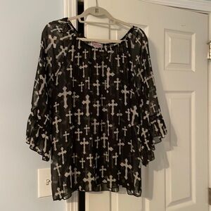 Reina brand sheer blouse size 1. Black background with cream colored crosses.